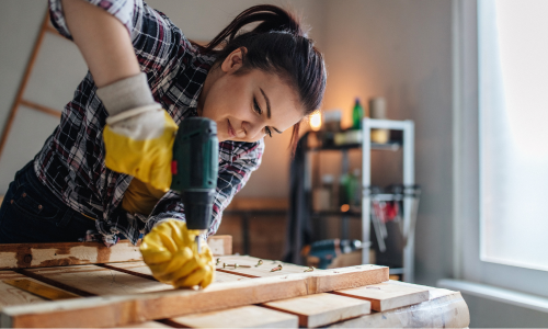 Woman using power drill